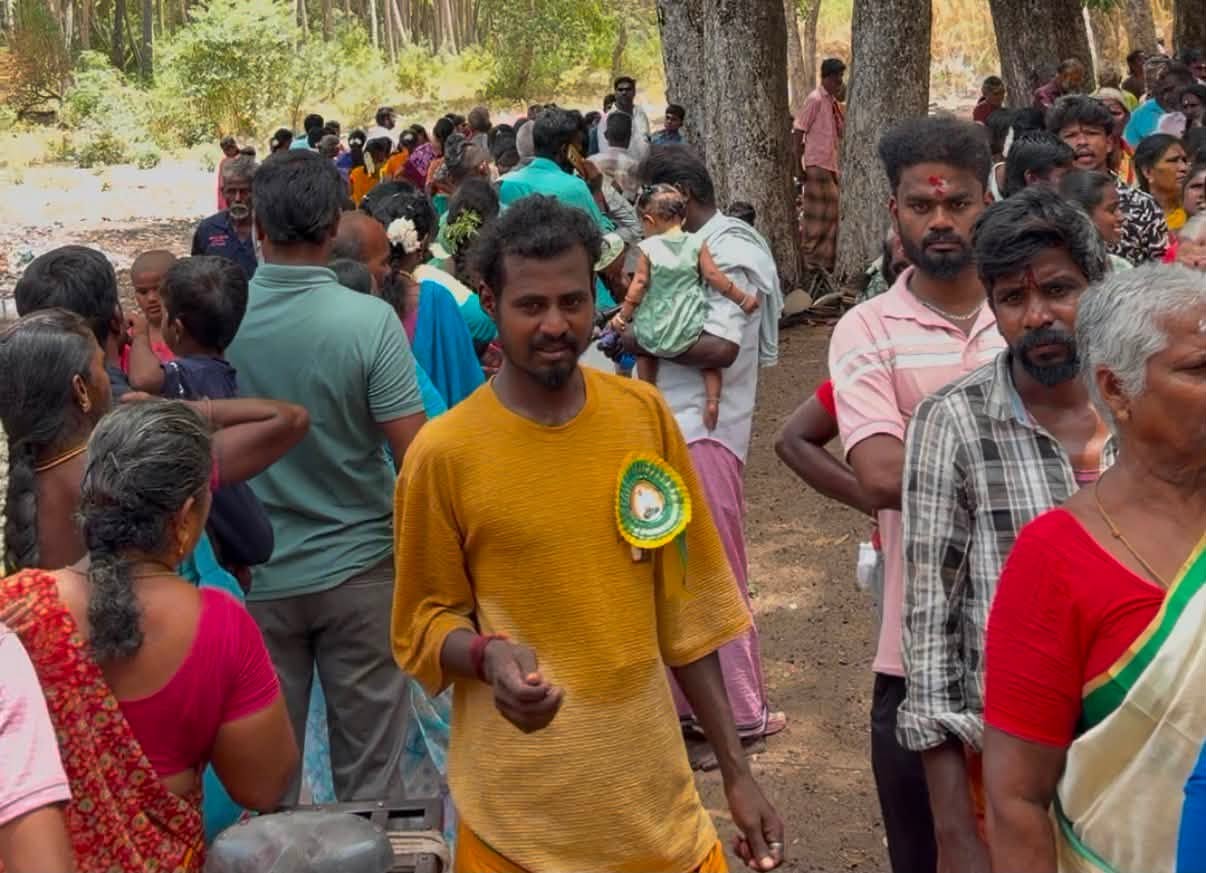 Volunteers serving food during a community programme