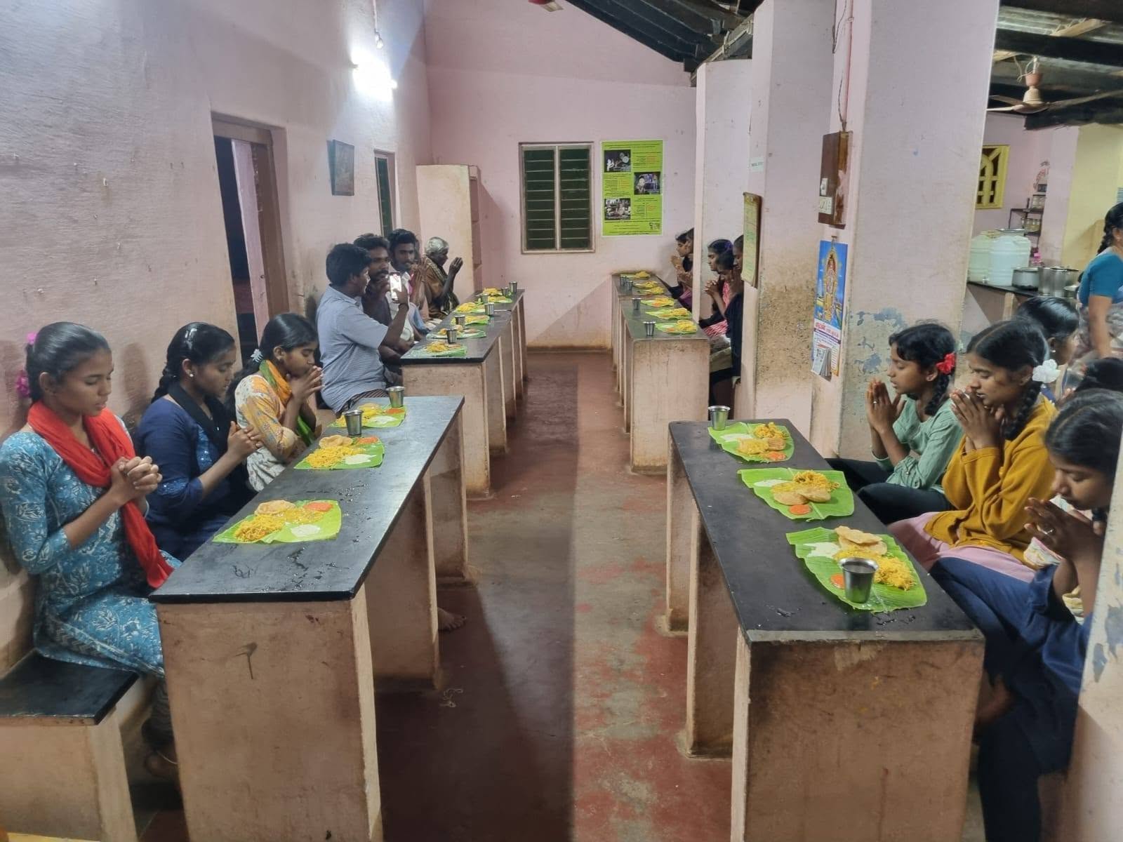 Community members taking part in an annadhanam programme