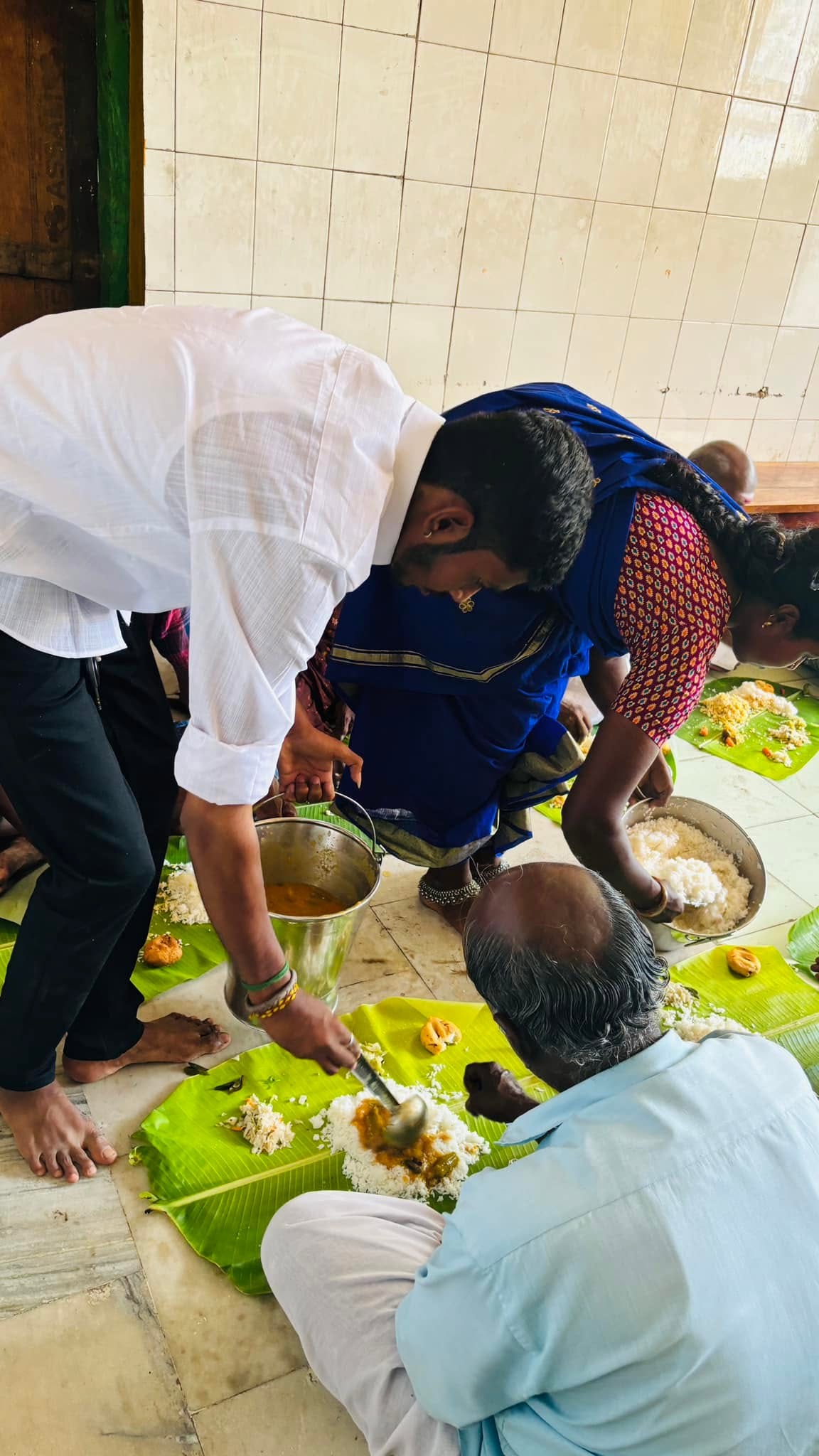 Volunteers serving food to community members
